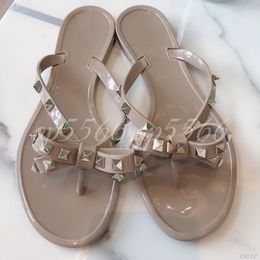 Women's Studded T-Strap Flip Flops with Bow Detail, Open Toe Flat Jelly Sandals for Summer Casual Wear