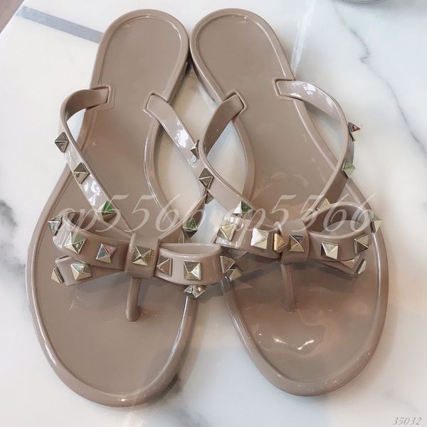 Women's Studded T-Strap Flip Flops with Bow Detail, Open Toe Flat Jelly Sandals for Summer Casual Wear